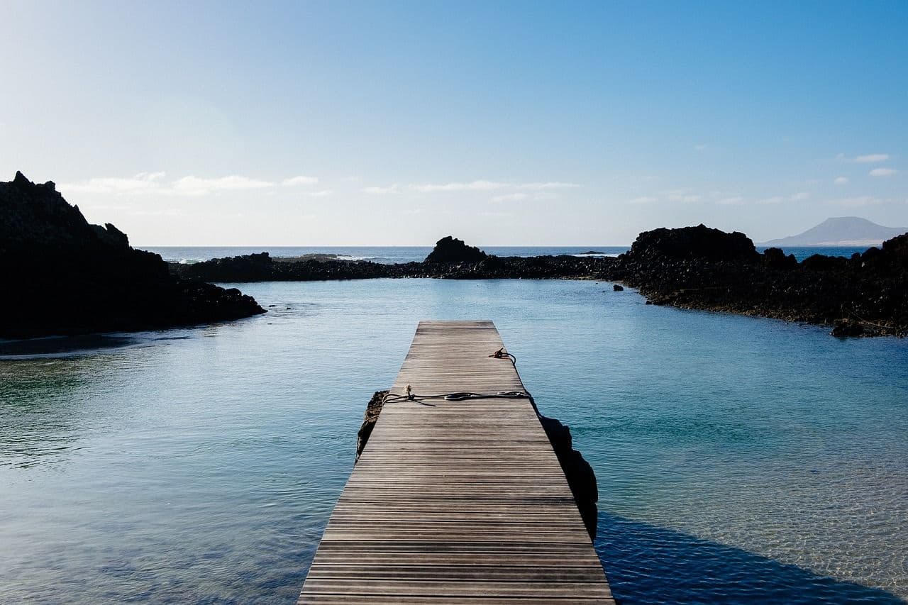 Dock over beach and rocks